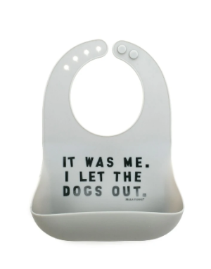 Gray silicone bib with the words "It was me. I let the dogs out."